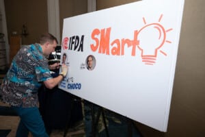 IFDA member drawing on white board